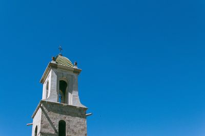 Low angle view of building against blue sky