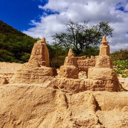 Ruins of rock formations against sky