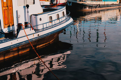 Fishing boats moored on lake