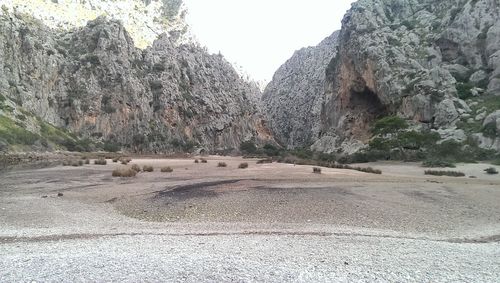 Panoramic shot of rocks on land against sky