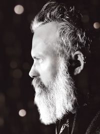 Close-up portrait of man looking away outdoors