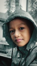 Portrait of young woman wearing warm clothing