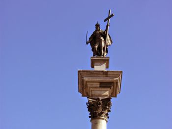 Statue against blue sky