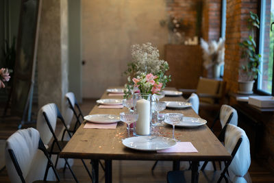 Empty chairs and tables in restaurant