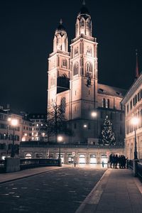Illuminated church in city at night