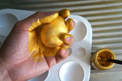 Cropped hand holding food