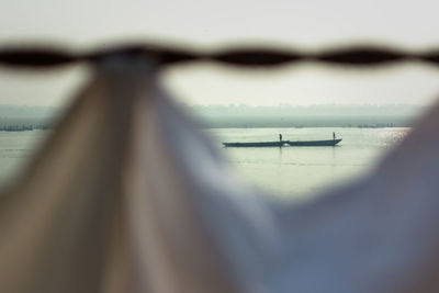 Sailboat on sea against sky