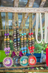 Close-up of decorations hanging at market stall