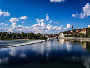 Scenic view of swimming pool by river against sky