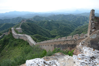 High angle view of castle on mountain against sky