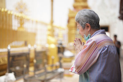 Woman praying at temple