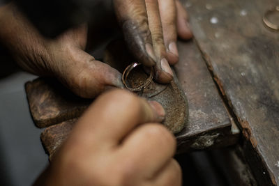 Cropped image of hands making ring