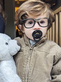 Portrait of boy with toy