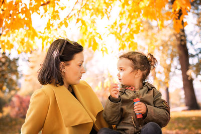 Woman with daughter at public park