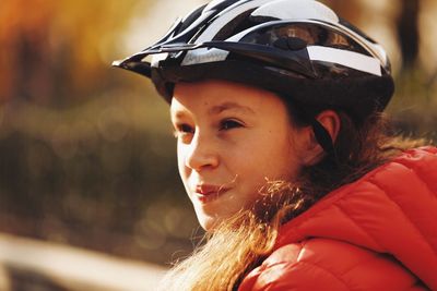 Close-up of teenage girl wearing cycling helmet