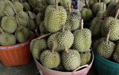 Durians in baskets for sale at street market