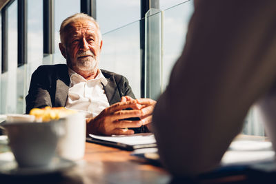 Friends sitting on table