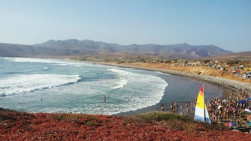 Scenic view of beach against clear sky