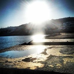 Scenic view of river against sky during sunset