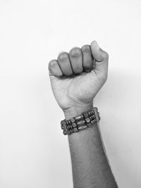 Close-up of human hand against white background