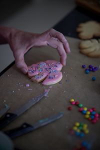 Midsection of person holding cookie