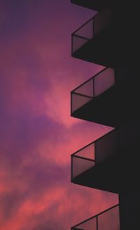 Low angle view of building against sky during sunset