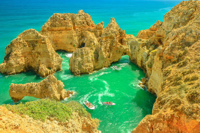 High angle view of rocks in sea