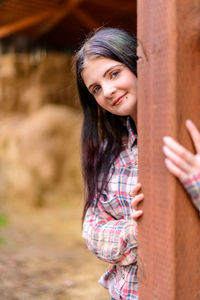 Portrait of young woman looking away