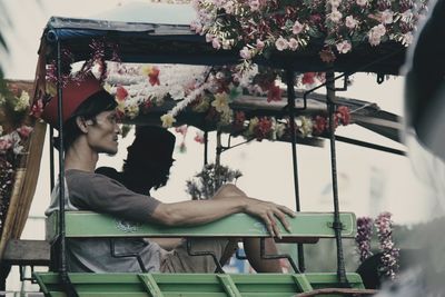 Young man sitting on chair