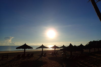 Scenic view of beach against sky during sunset