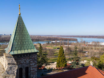 Panoramic view of buildings against clear blue sky