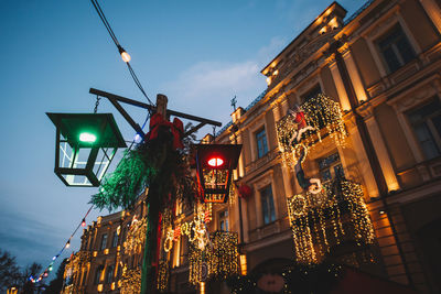 Low angle view of illuminated street light at night