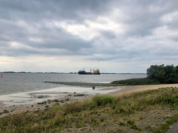 Scenic view of beach against sky