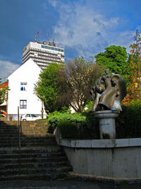 Low angle view of statue against building