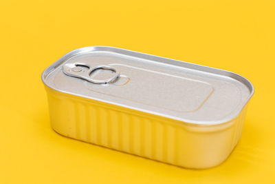 Close-up of usb stick against yellow background