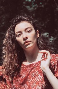 Portrait of beautiful young woman looking away