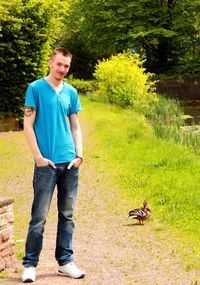 Young man standing on grass