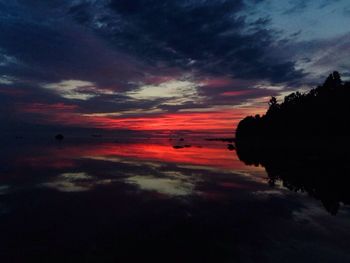 Scenic view of beach against dramatic sky