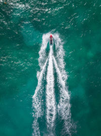 Aerial view of sailing in jet boat on sea