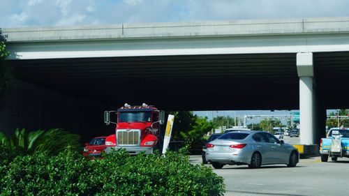 Car on bridge against sky