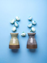High angle view of candies against blue background