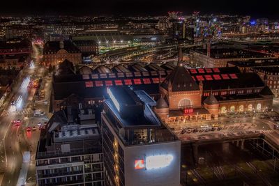 Aerial view of city lit up at night