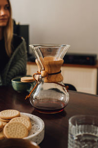 Midsection of woman with coffee cup