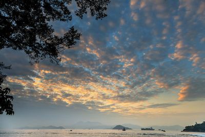 Scenic view of sea against dramatic sky