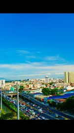 View of cityscape against blue sky