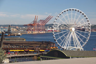 High angle view of seattle ferris wheel above elliott bay barbour against blue sky
