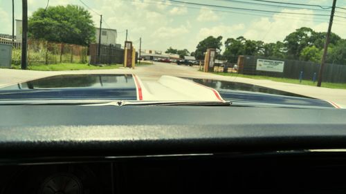 Road seen through train windshield