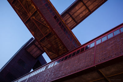 Low angle view of bridge against sky, zeche zollverein 