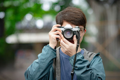 Portrait of man photographing