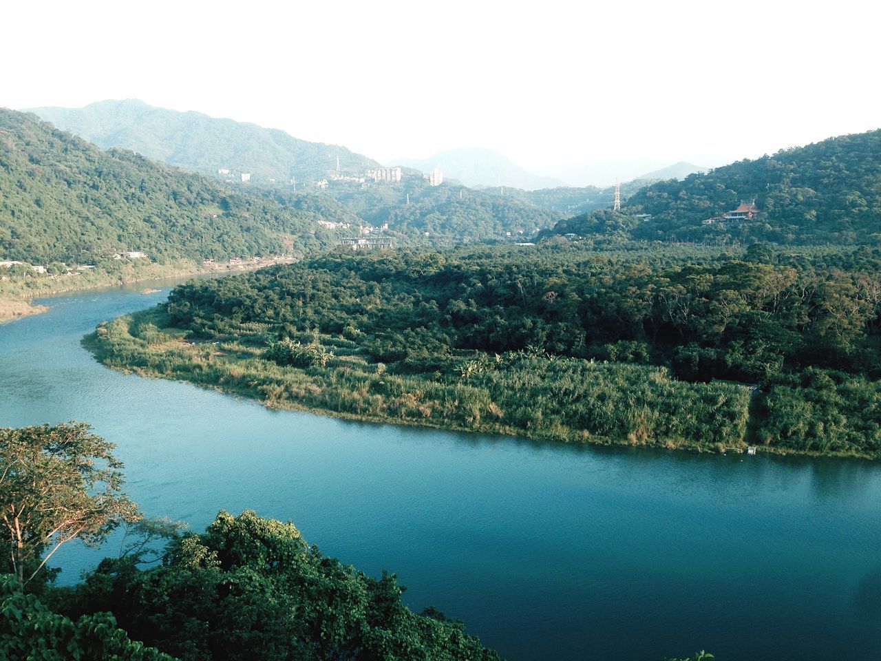 water, tranquil scene, mountain, tranquility, scenics, tree, beauty in nature, clear sky, lake, nature, reflection, idyllic, landscape, mountain range, waterfront, growth, green color, river, non-urban scene, calm